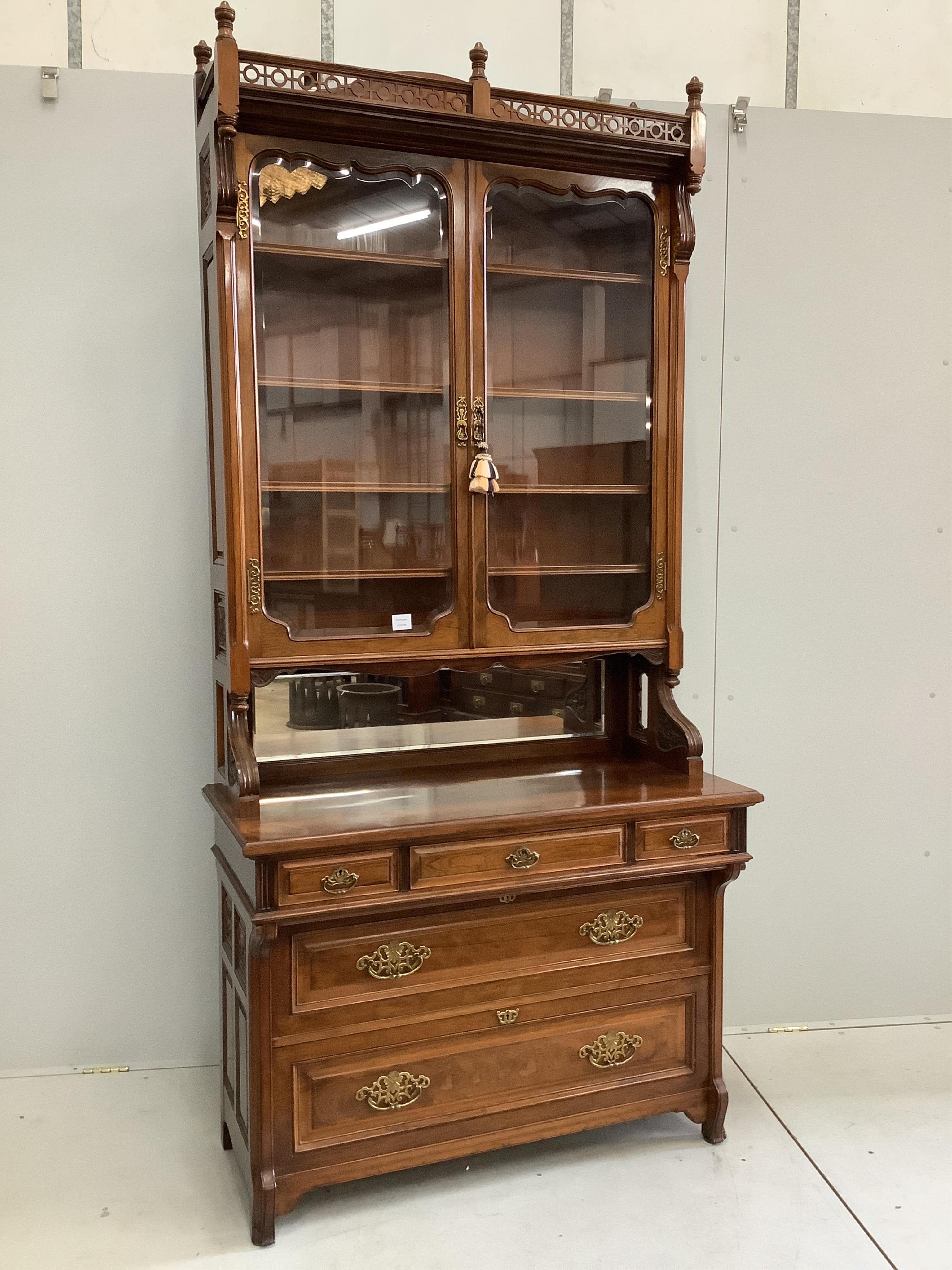 A Victorian rosewood bookcase, width 108cm, depth 52cm, height 232cm